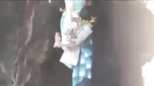 Arab woman in blue dress holding flowers, bare feet upskirt tease