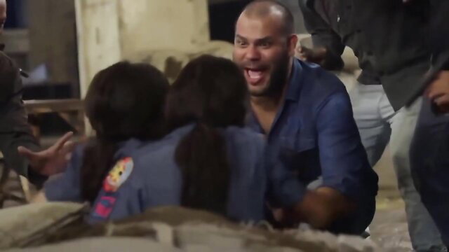 Bald man grinning at Filipina policewomen in uniforms BDSM scene