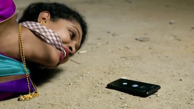 Indian beauty bound gagged captive BDSM on sandy ground