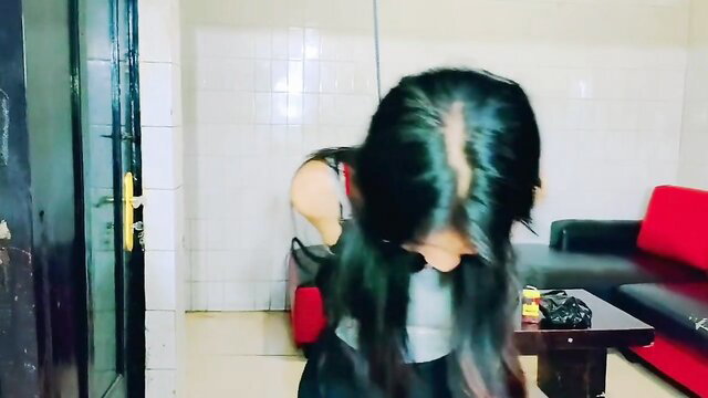 Asian woman bound in BDSM, bent over topless with panties down