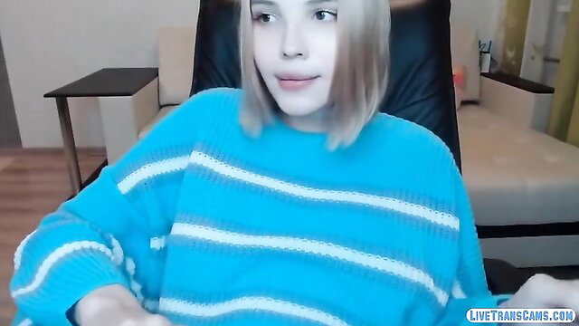 Tranny teen model in blue sweater strokes tiny cock on webcam
