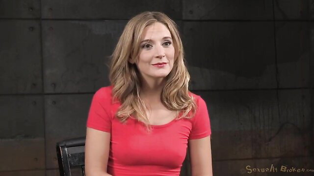 Mona Wales in red top looking aside