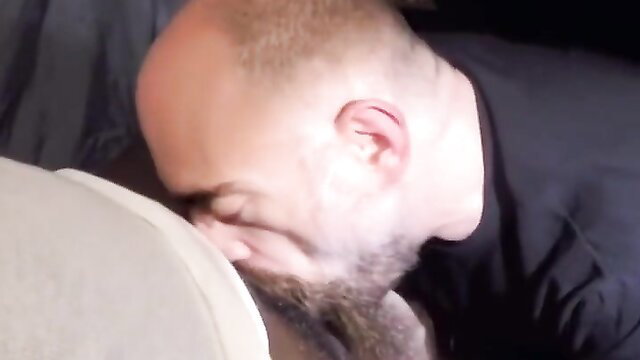 Bald bearded man facefucked on couch in hot gay handjob porn