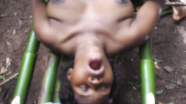 Ebony twink upside down on bamboo, mouth open wide, black gay porn thumbnail