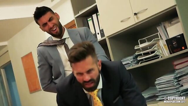 Dani Robles fucks suited guy doggy style in office gay porn