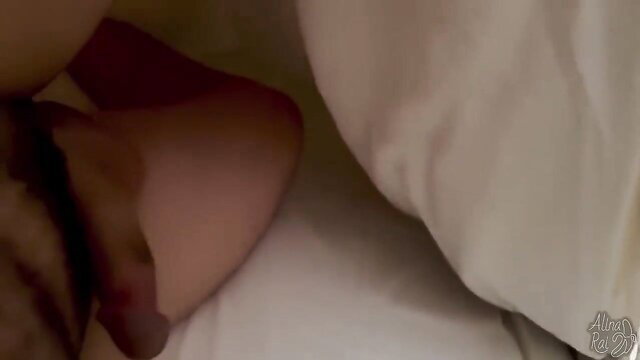 Stepmom's nude curves peek from white sheets in hotel bed tease