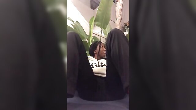 Ebony babe flashing pussy in public with plants around