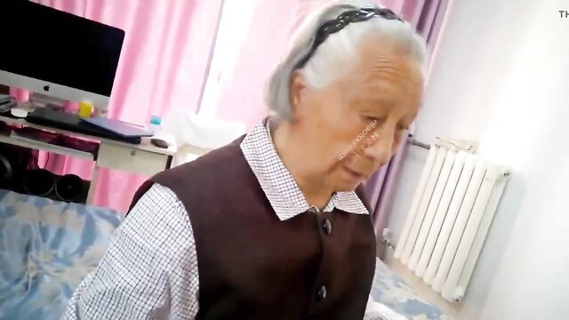 Chinese granny in checkered shirt and vest, closeup portrait