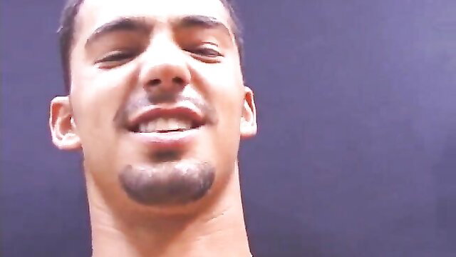 Sexy young Latino guy with goatee smirking closeup in Hot BF video