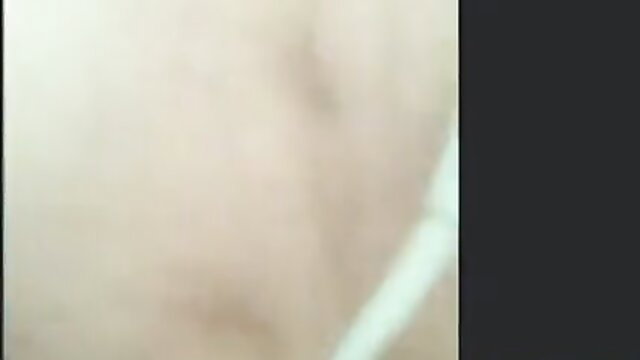 Blurry closeup of nude Asian woman with pale skin and long dark hair