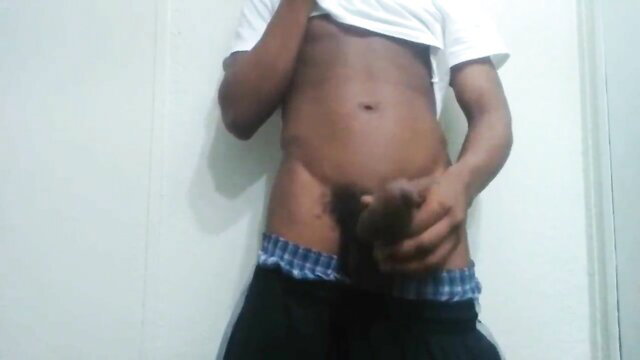 Black guy with big black monster BBC bulging in blue briefs, Mandingo style