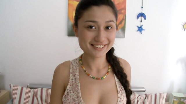 Sexy Russian college girl in low-cut top smiling seductively