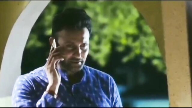 Handsome Indian man in blue kurta on emotional phone call, hot bhabhi scene