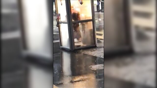 Blurry public phone booth sex caught on video in rain