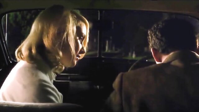 Blonde bombshell in vintage car blowjob scene from Hollywood movie