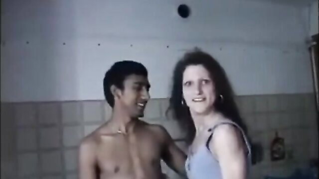 Indian guy bare-chested embraces white brunette in lingerie, Madagascar amateur