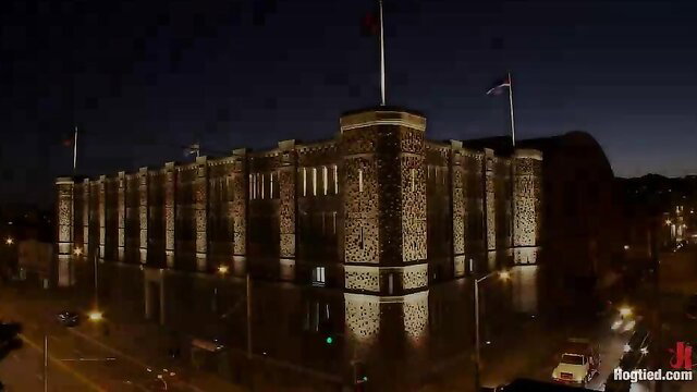 Tower of London lit up at night, historic fortress castle aerial view