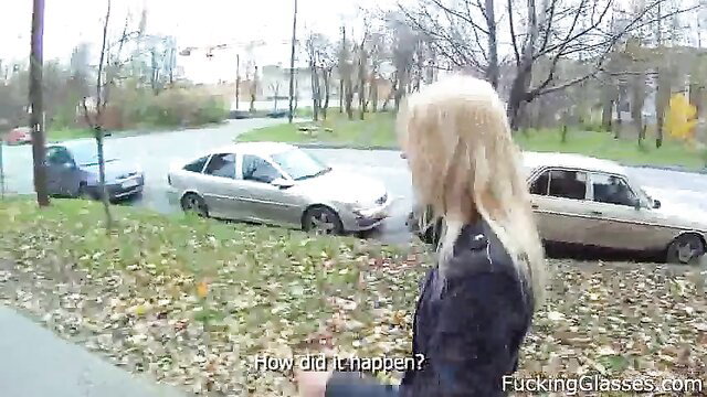 Blonde cutie in leather jacket by cars asks 'How did it happen?'