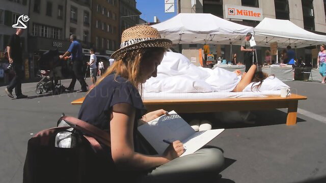 Amanda nude in bed at Swiss market, artist sketching her body