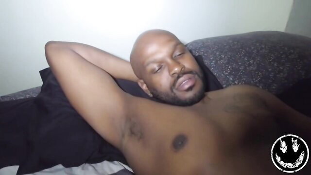 Bald muscular Black man lying shirtless in bed Destiny Lovee thumbnail
