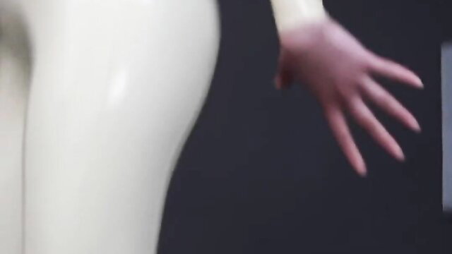 Shiny latex catsuit babe in ballet boots poses seductively