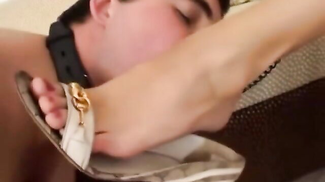 Russian mistress forces male slave to kiss her sexy legs and feet in BDSM