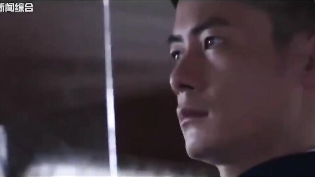 Handsome Asian man intense profile gaze in dim BDSM scene