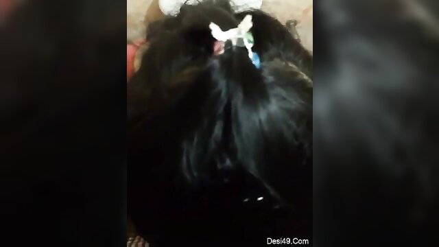 Beautiful Indian desi girl with black hair and butterfly hair clip closeup