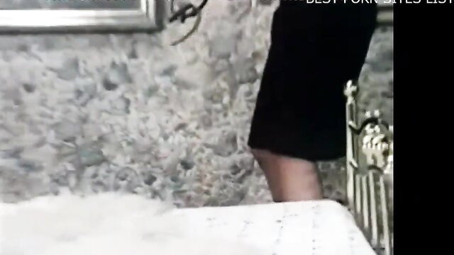 Retro lesbian in black dress on bed, Color Climax vintage softcore