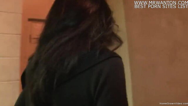 Smoking hot MILF in black hoodie viewed from behind in Vegas hotel