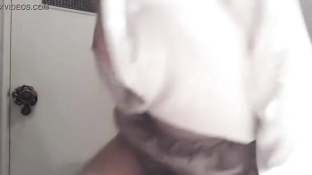 Amateur solo babe in hoodie spreads legs in bathroom mirror