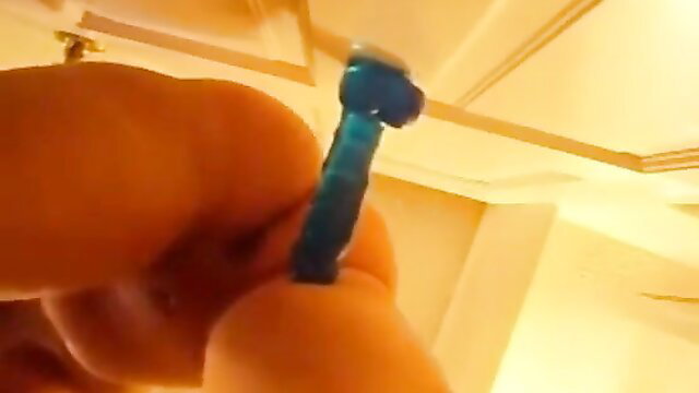 Amateur Latina babe masturbates with blue dildo closeup POV