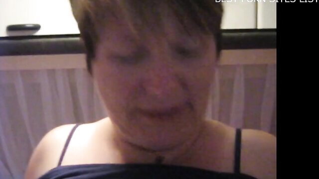 Closeup of mature German woman's face in dim light, amateur slut preview