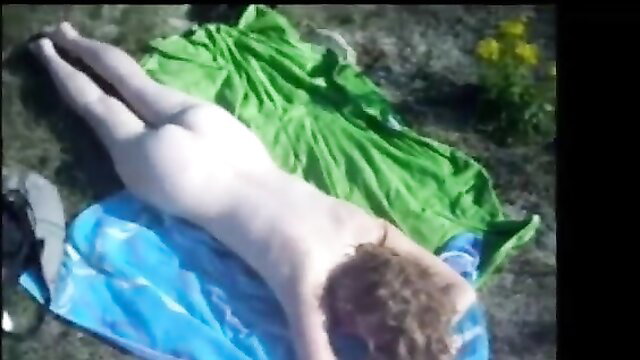 Dune nude sunbathing ass up on beach towel in dunes