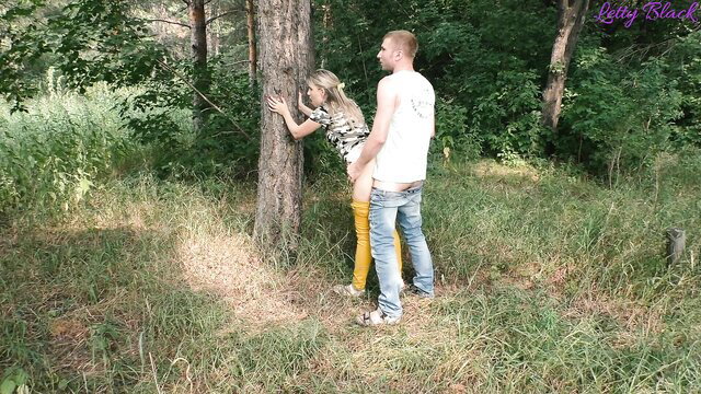 Blonde in stockings fucked doggystyle by stranger against tree in park