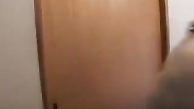 Japanese mature BBW standing nude by door in JAV scene