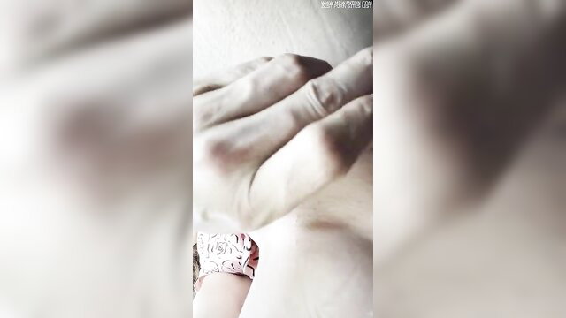 Closeup hand inserting butt plug and rubbing pussy in parking lot