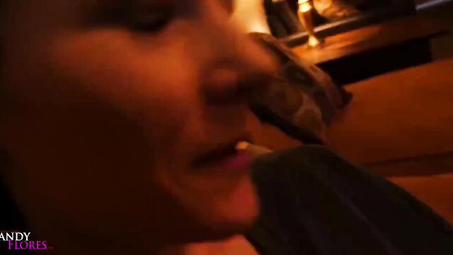 Mandy Flores closeup face in dim light, seductive lips and piercing gaze