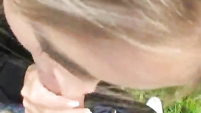 Nessa Devil sucking cock outdoors on meadow