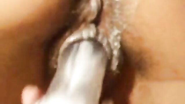 Close-up of a penis being masturbated