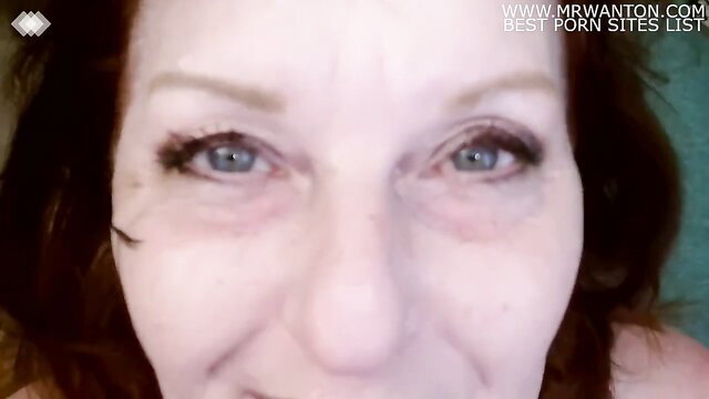 Closeup of mature woman's seductive eyes and face in amateur video