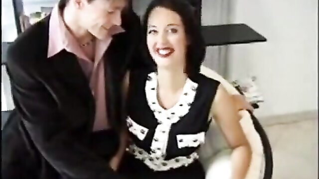 Monica Roccaforte in black white dress groped by man closeup