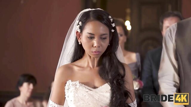 Killa Raketa as sexy Asian bride in lace wedding dress vows
