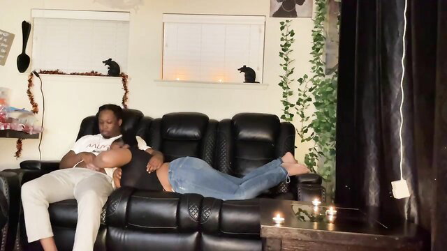 Black stepsis cuddles guy on couch in tight jeans during steamy movie night