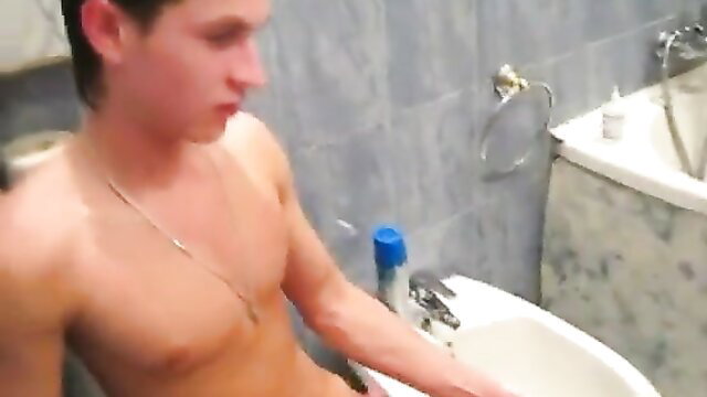 Naked young man washing cock in bathroom sink, Young Libertines