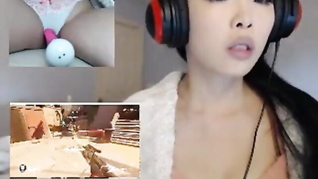 Asian gamer girl with pink vibrator in pussy while streaming Overwatch