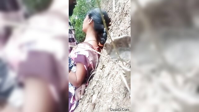 Indian Telugu woman in sheer saree exposing curves outdoors
