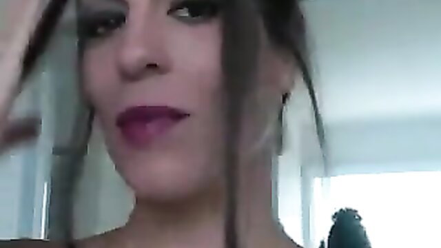 Woman with purple lipstick giving a suggestive look