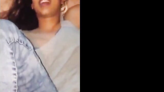 Tamil Indian babe laughing in sheer top, teasing cleavage closeup