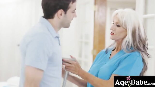 Jake Adams tempted by old nurse's delicate touch in blue scrubs